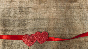 Red ribbon tape and two hearts